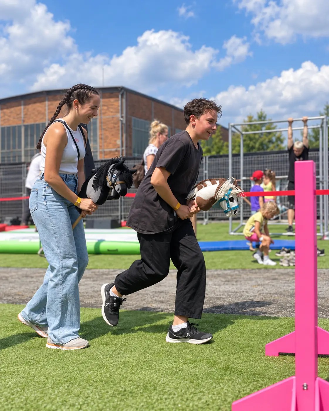 Older participants in active play with hobby horses